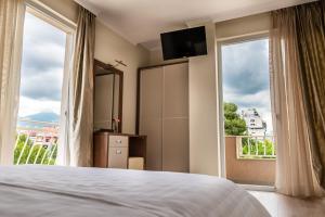 Postel nebo postele na pokoji v ubytování KEIT Hotel