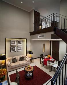 a living room with a couch and a table at Orchard Parksuites by Far East Hospitality in Singapore