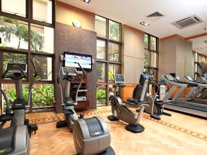 a gym with treadmills and elliptical machines at Orchard Parksuites by Far East Hospitality in Singapore