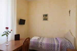 Ostello Villa Monte Mario客房内的一张或多张床位