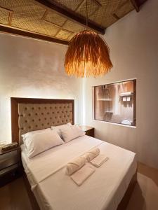 Postel nebo postele na pokoji v ubytování Inbox Siargao Resort