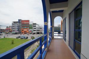 a balcony of a building with a view of a city at Xiang Yang Lan Tian Homestay in Taitung City