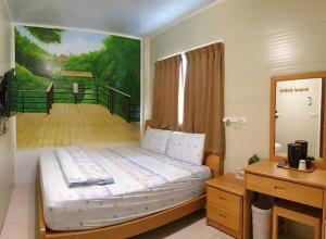 Postel nebo postele na pokoji v ubytování Yujing B&B