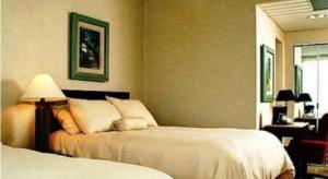 Hotel Honduras Maya客房内的一张或多张床位