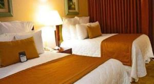 Hotel Honduras Maya客房内的一张或多张床位