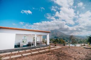 a house with a view of the mountains at Moon Batur Cabin in Kubupenlokan