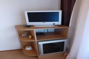 a computer monitor sitting on top of a desk at Guest House Villa Daniel - Two Bedroom Apartment with Balcony in Omiš