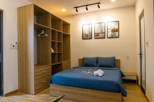 Ένα ή περισσότερα κρεβάτια σε δωμάτιο στο New Happy House Homestay's My Khe Beach with 4BR