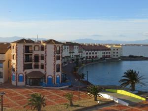 a view of a city with a large swimming pool at Appartement Marina in Le Barcarès