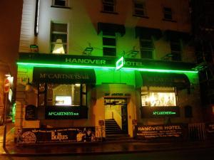 ahmower hotel with green lights in front of a building at Hanover Hotel & McCartney's Bar in Liverpool