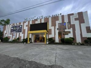 a building with a large design on the front of it at Kojo Hotels Premier in Tagum