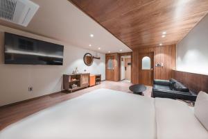 Gyeongju Coolstay hotel客房内的一张或多张床位