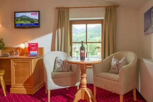 Telewizja i/lub zestaw kina domowego w obiekcie Hotel Reitlwirt