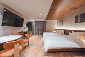 Gyeongju Coolstay hotel客房内的一张或多张床位