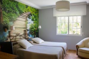 Postel nebo postele na pokoji v ubytování Hotel Iris La Eliana