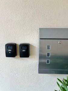 two electrical outlets on a wall with at Privatzimmer Burgpanorama in Raabs an der Thaya