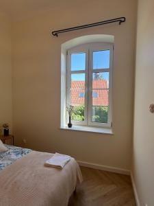 Postel nebo postele na pokoji v ubytování Apartament Frombork Łempicka