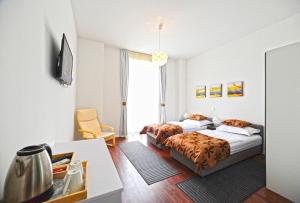 Postel nebo postele na pokoji v ubytování Valenti rooms