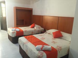 Un pat sau paturi într-o cameră la Hotel Via Espana