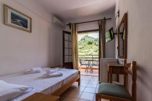 Postel nebo postele na pokoji v ubytování Hotel Sylvia