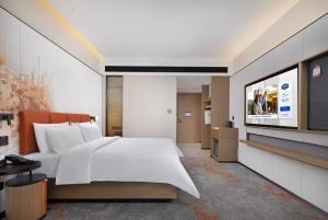 TV a/nebo společenská místnost v ubytování Hampton By Hilton Dongguan Nancheng Xiping