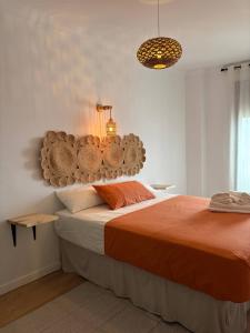 En eller flere senge i et værelse på Casa Lolita