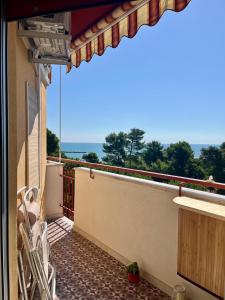 a balcony with chairs and a view of the ocean at Casa Mar Montesilvano in Montesilvano