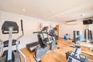 a gym with several treadmills and cardio machines at House 3 in Looe