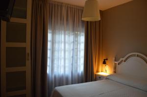 Posteľ alebo postele v izbe v ubytovaní Hotel Chancelas