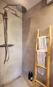 a bathroom with a towel rack and a shower at B&B Antonius beej de Maas in Venlo