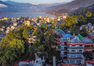 an aerial view of a city with a lake at Northern Suite Home in Pokhara
