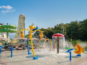a playground with a water park with a water slide at XO CAPE ARNNA Fethiye in Fethiye