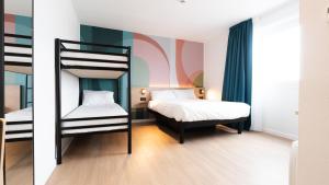 Letto o letti in una camera di B&B HOTEL Mons Gare