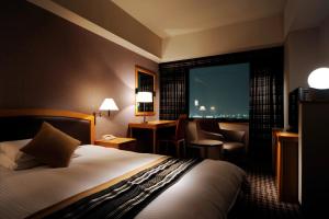 Postel nebo postele na pokoji v ubytování Royal Pines Hotel Urawa