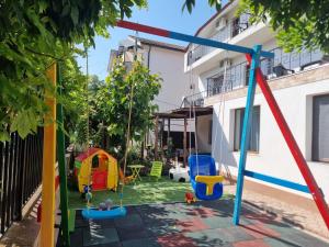 a playground in the backyard of a house at EfoRooms - Apartamente si Camere moderne in Eforie Nord
