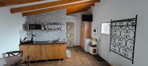 a kitchen with a sink and a counter top at Ceremoniár in Poľný Kesov