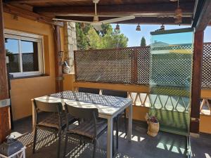 a patio with a table and chairs on a balcony at Apartamento Caballito de Mar con PARKING in L'Estartit +35 photos
