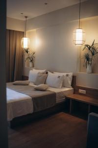 Ein Bett oder Betten in einem Zimmer der Unterkunft Rea Boutique Hotel