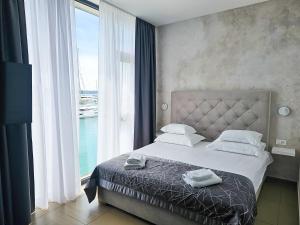 Posteľ alebo postele v izbe v ubytovaní Marina Baotić Apartments + 37 fotografií