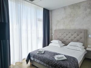 Posteľ alebo postele v izbe v ubytovaní Marina Baotić Apartments