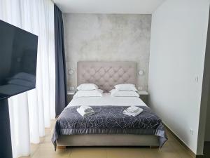 Posteľ alebo postele v izbe v ubytovaní Marina Baotić Apartments