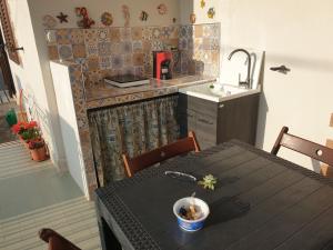 a kitchen with a table with a bowl of food on it at Villa Maria in Campobello di Mazara