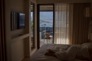 Ein Bett oder Betten in einem Zimmer der Unterkunft Rea Boutique Hotel