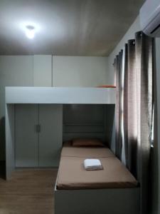 Ένα ή περισσότερα κρεβάτια σε δωμάτιο στο The Nuebes Townhouse CDO