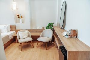 Ein Bett oder Betten in einem Zimmer der Unterkunft Rea Boutique Hotel