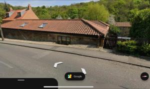 a view of a house on the side of a road at 1 Kilton Mill in Carlin How
