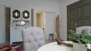 a living room with a table and two chairs at Gara Cottage Private escape with modern comfort and spacious covered terrace in Garabonc