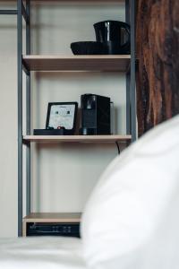 Postel nebo postele na pokoji v ubytování Geo Hotel
