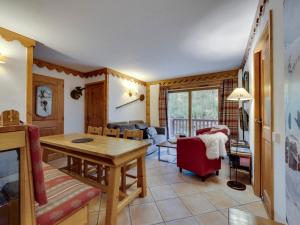 a living room with a table and a couch at Tignes Val Claret: Appartement 4 pièces pour 6 pers, Wi-Fi, linge fourni - FR-1-641-76 in Tignes
