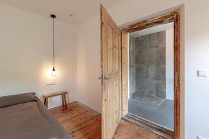 a bedroom with a shower and a sliding door at GERN Magnolie in Unterwössen +15 photos